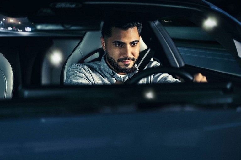 Person sitting in the driver’s seat of a parked 2024 Ford Mustang® coupe | Wade Ford in Smyrna GA